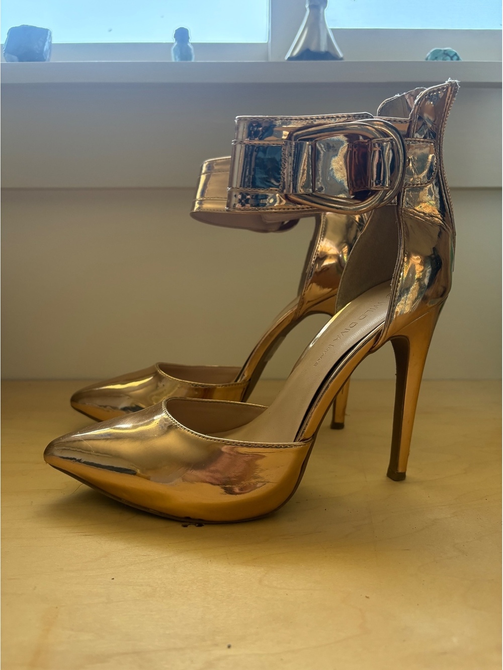 Metallic rose gold ankle strap high heels